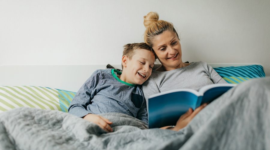 Mother and son in bedroom spend some quality time