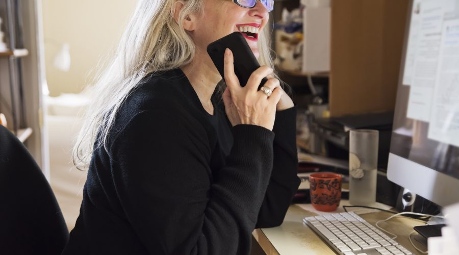 Stylish 50+ woman working from home.