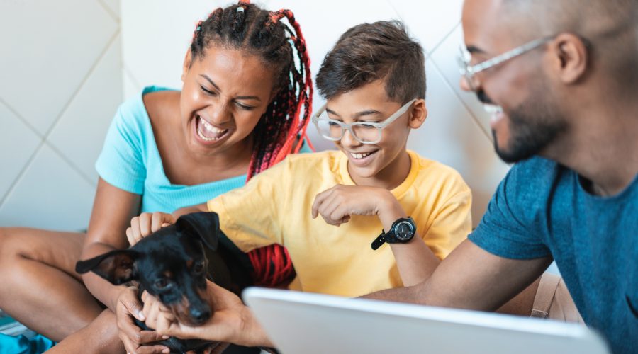 Family having fun with their pet